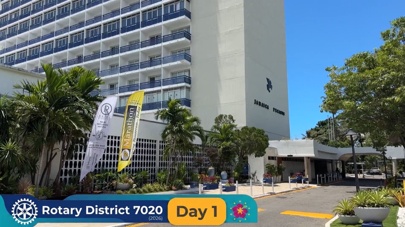 Rotary and sponsor banners stand outside the Jamaica Pegasus on the opening day of the District 7020 Conference.
