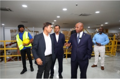 Officials tour the Dr. Reddy’s warehouse in Kingston during the export milestone event.