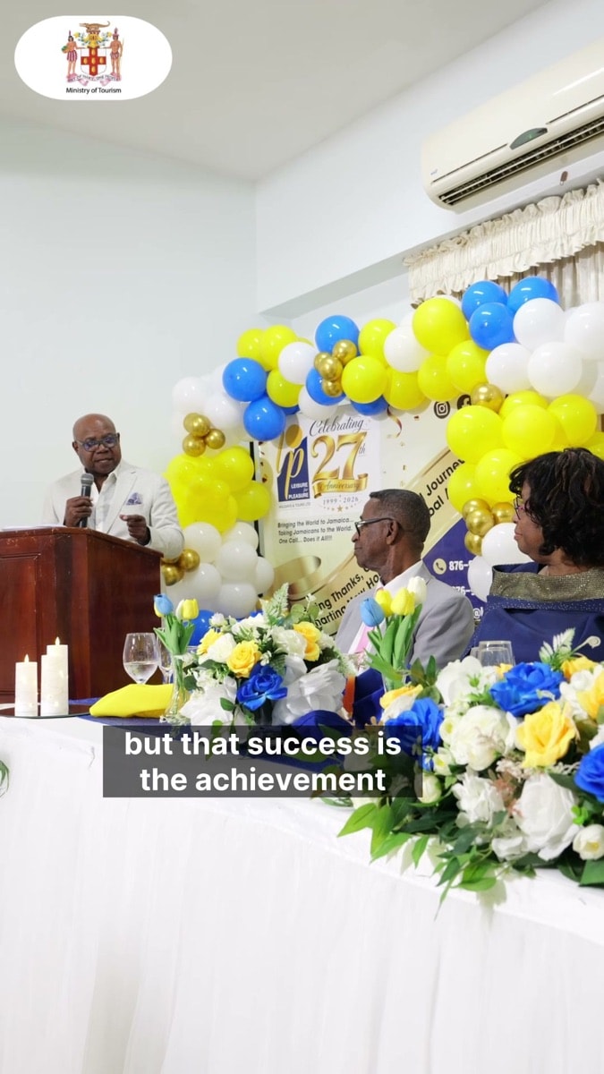 The head table and 27th anniversary backdrop at The Medallion Hotel in Kingston.